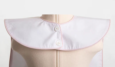 White Oversized Bib with Pink Piping